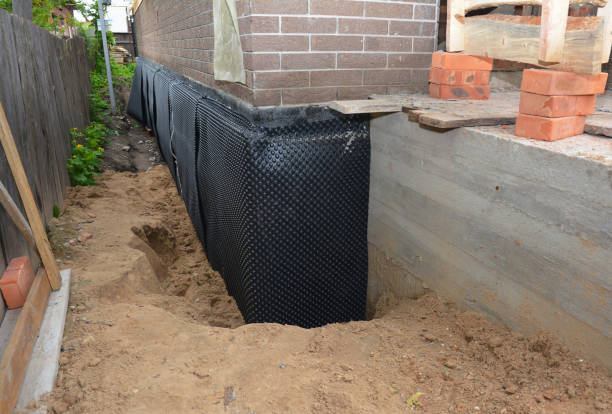 SJ Waterproofing Pros technician performing targeted Waterproofing assessment in Westland, MI